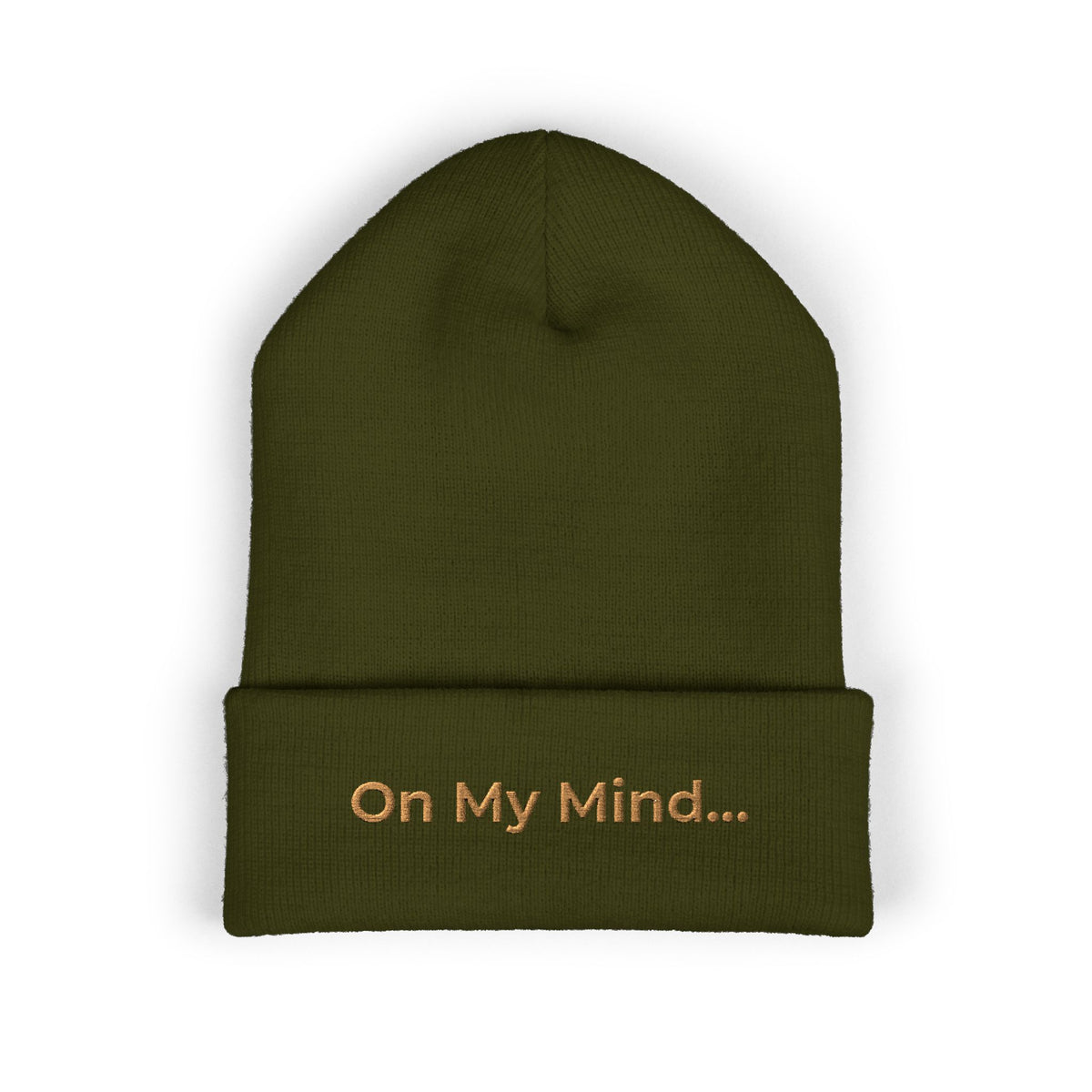 Olive cuffed beanie with gold “On My Mind...” embroidery on the front.