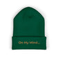 Spruce cuffed beanie with gold “On My Mind...” embroidery on the front.